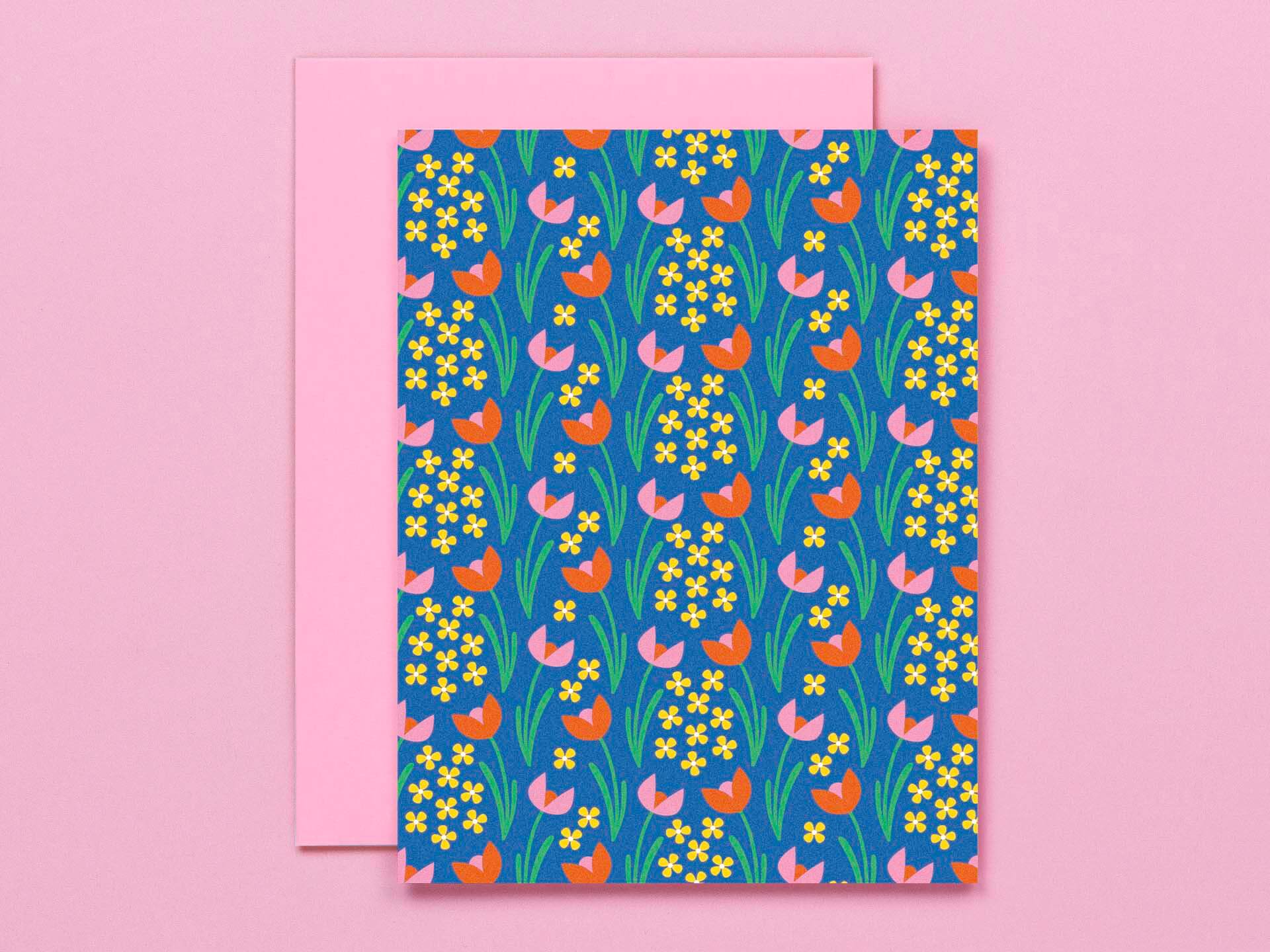 a card with a floral pattern on a pink background