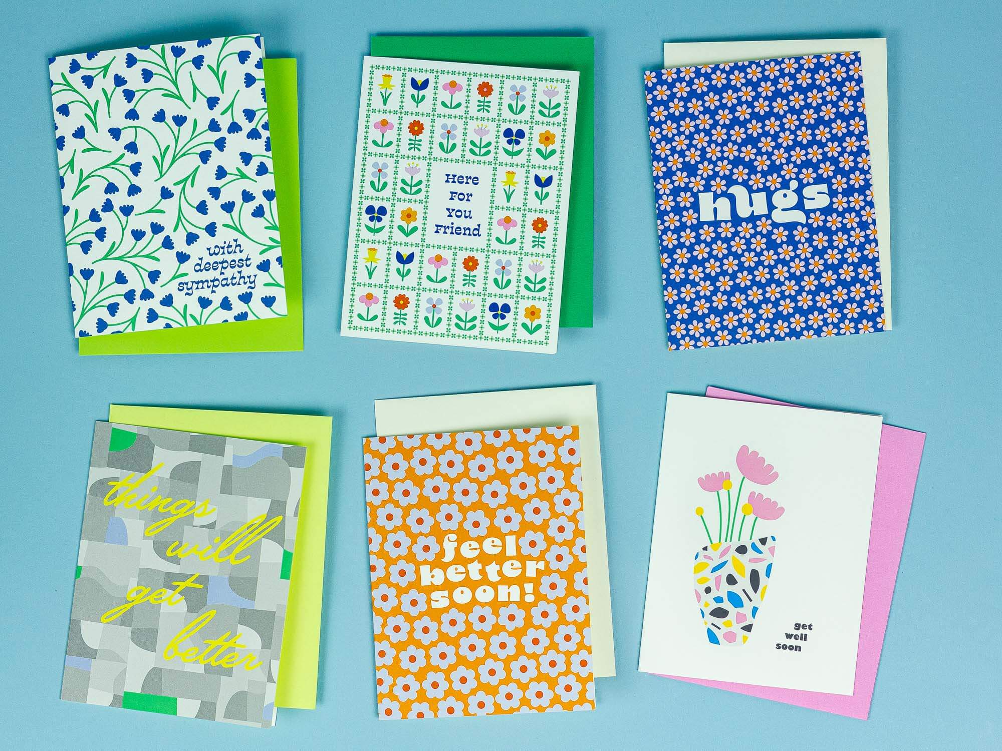 a group of four greeting cards sitting on top of a table
