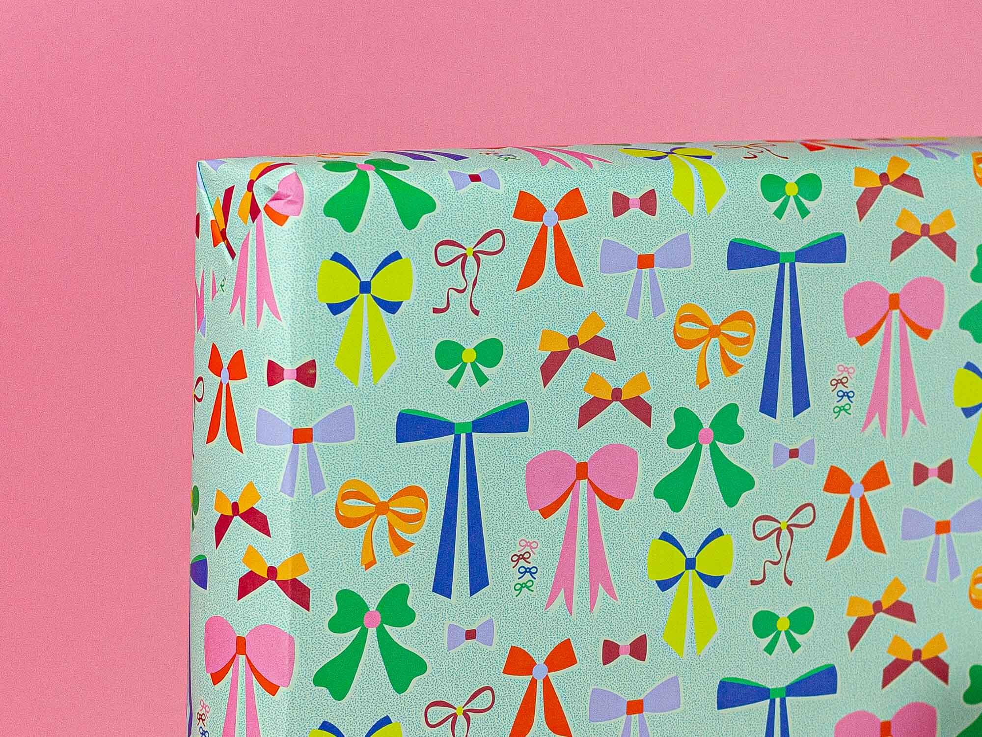 a blue gift box with colorful bows on it