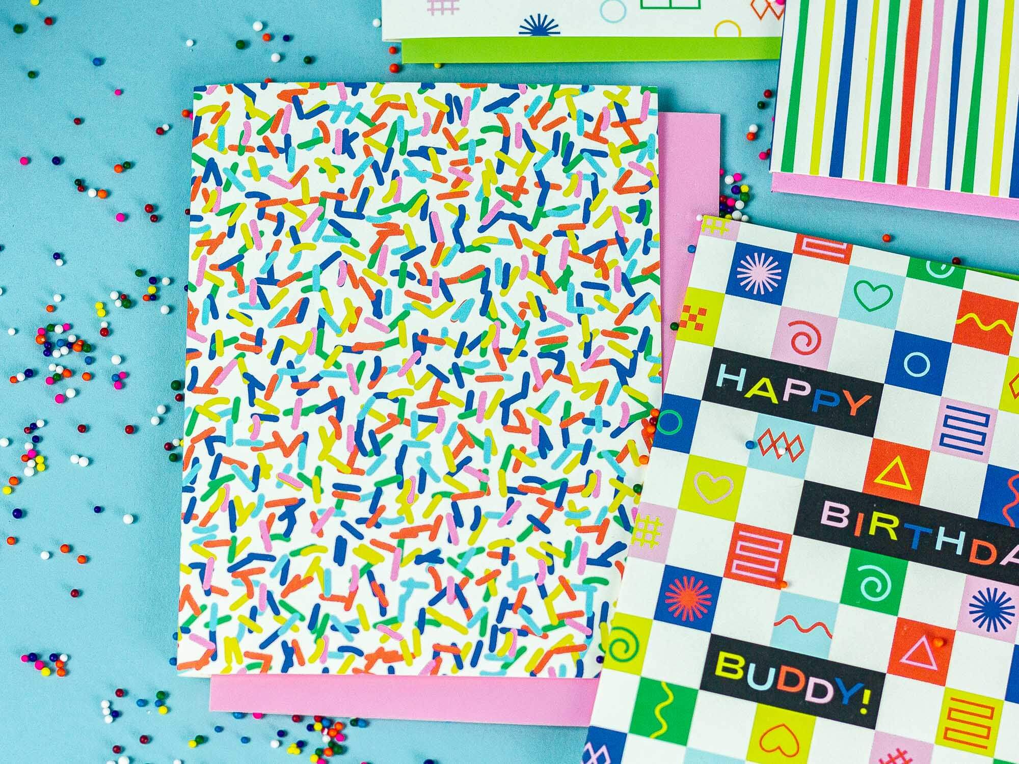 a table topped with lots of different colored papers