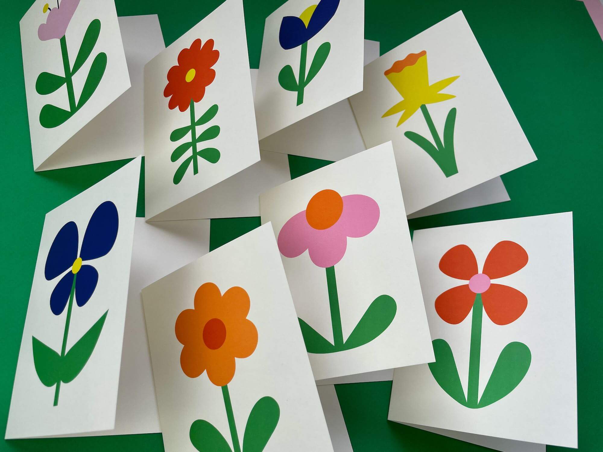 a bunch of cards that have flowers on them