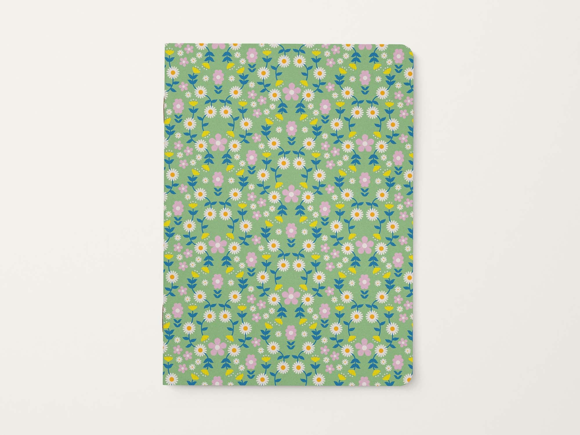 Retro Scandinavian inspired floral patterned notebook on a light green background