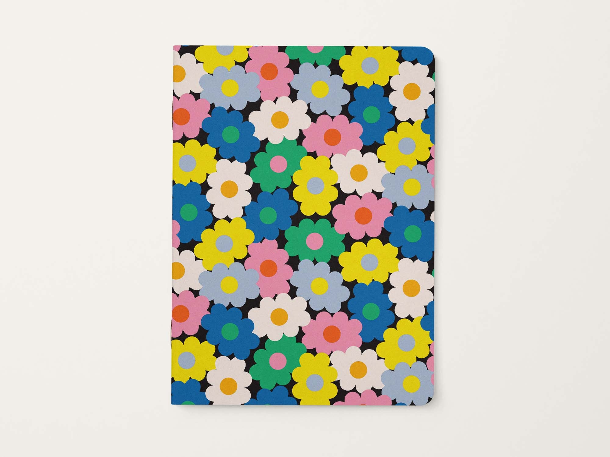 Notebook with colorful vibrant retro floral pattern on a black background