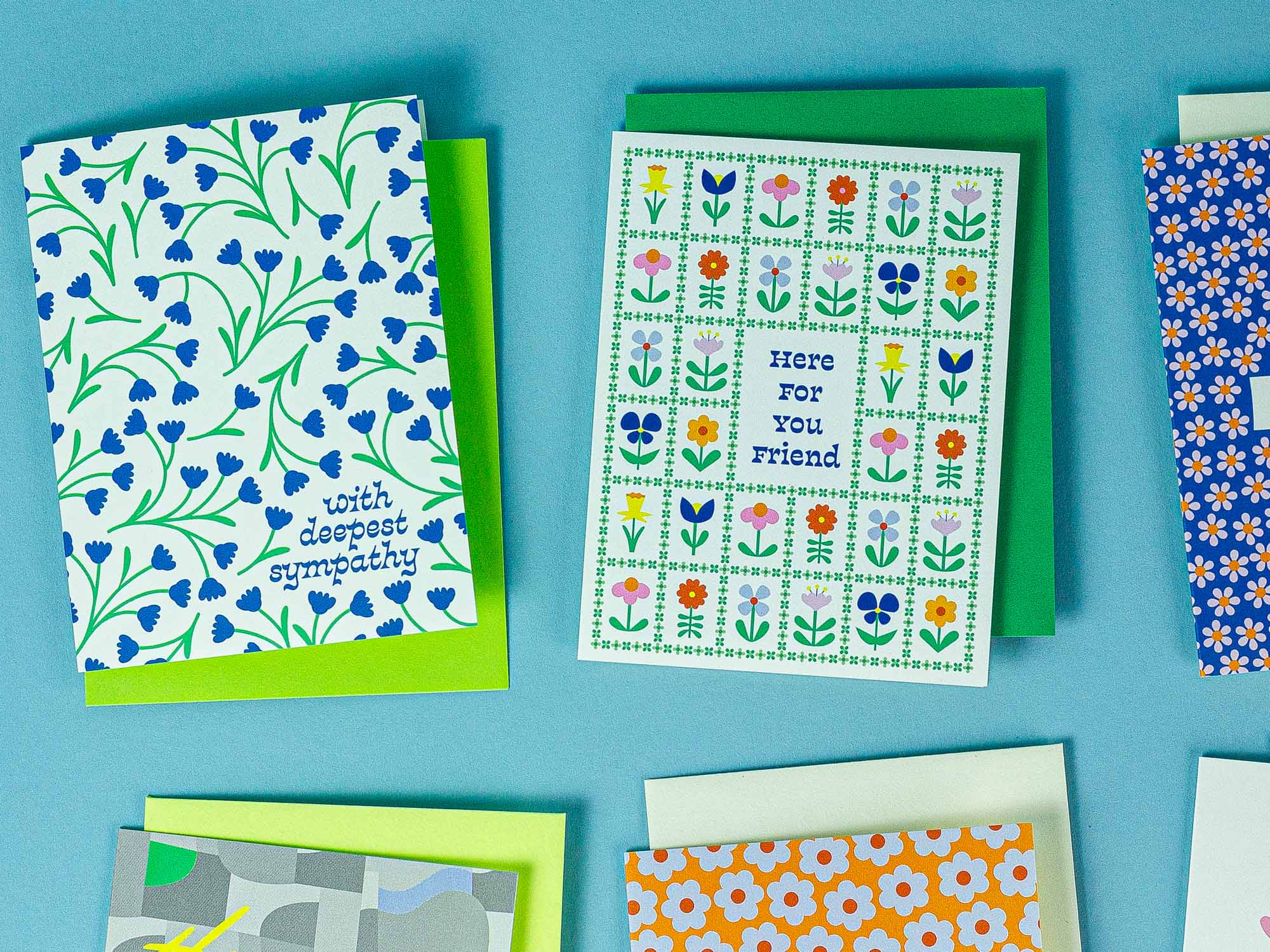 a group of greeting cards on a blue surface