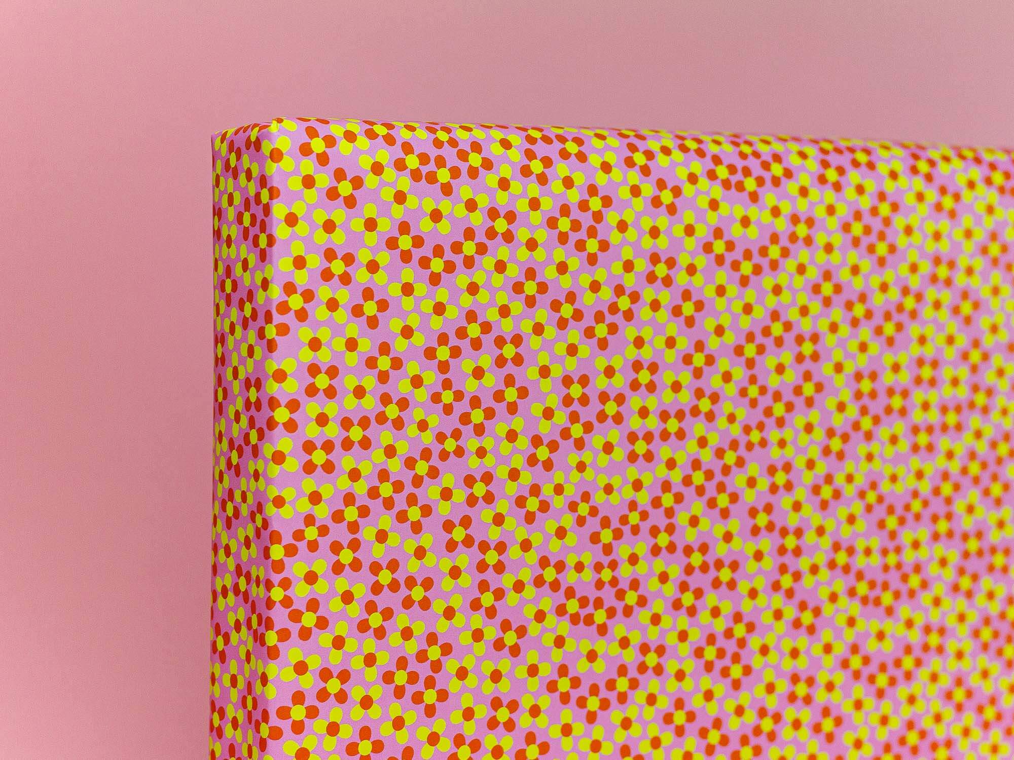 a pink and yellow polka dot pattern on a pink background