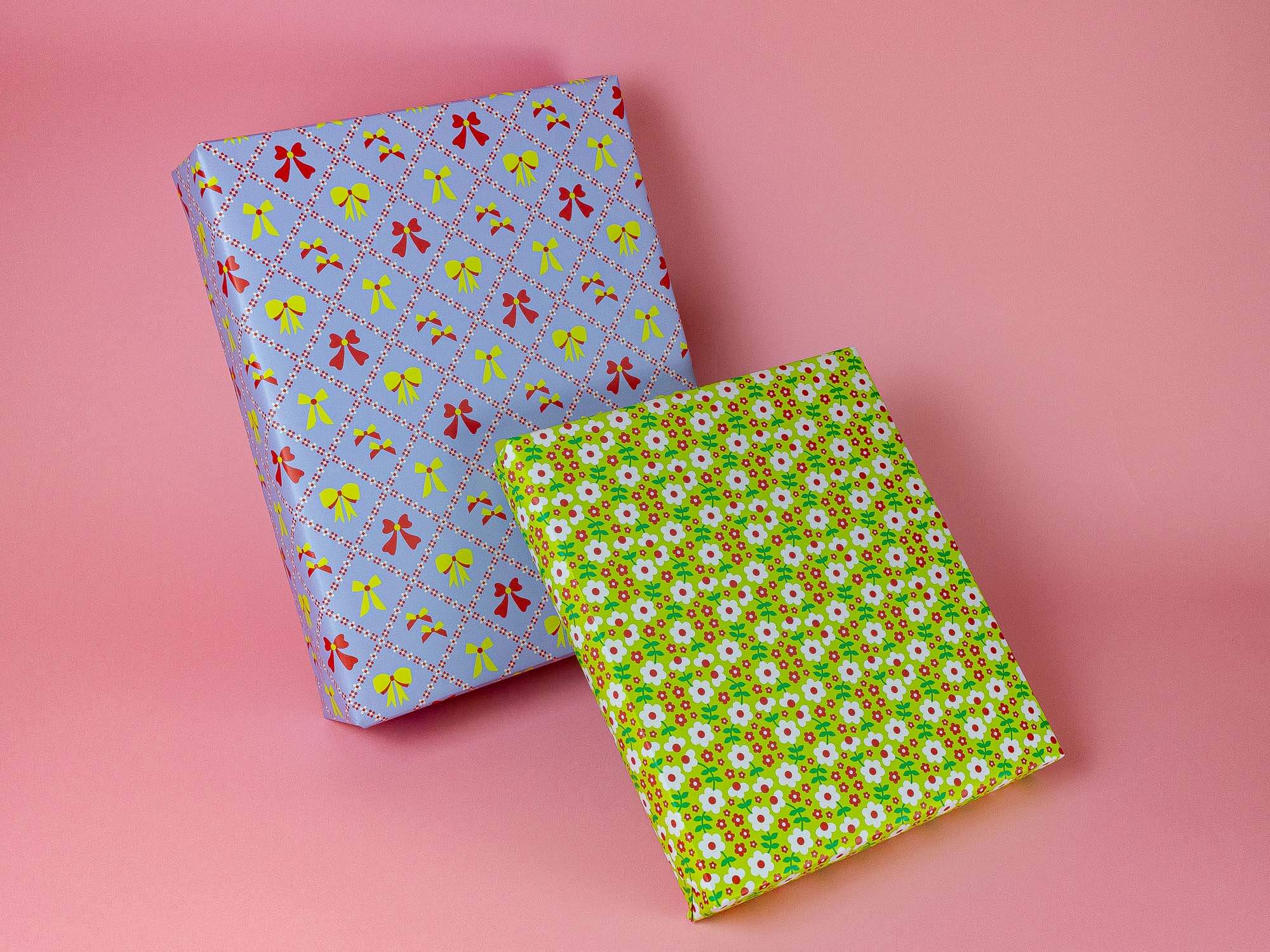 a pair of wrapping paper on a pink background