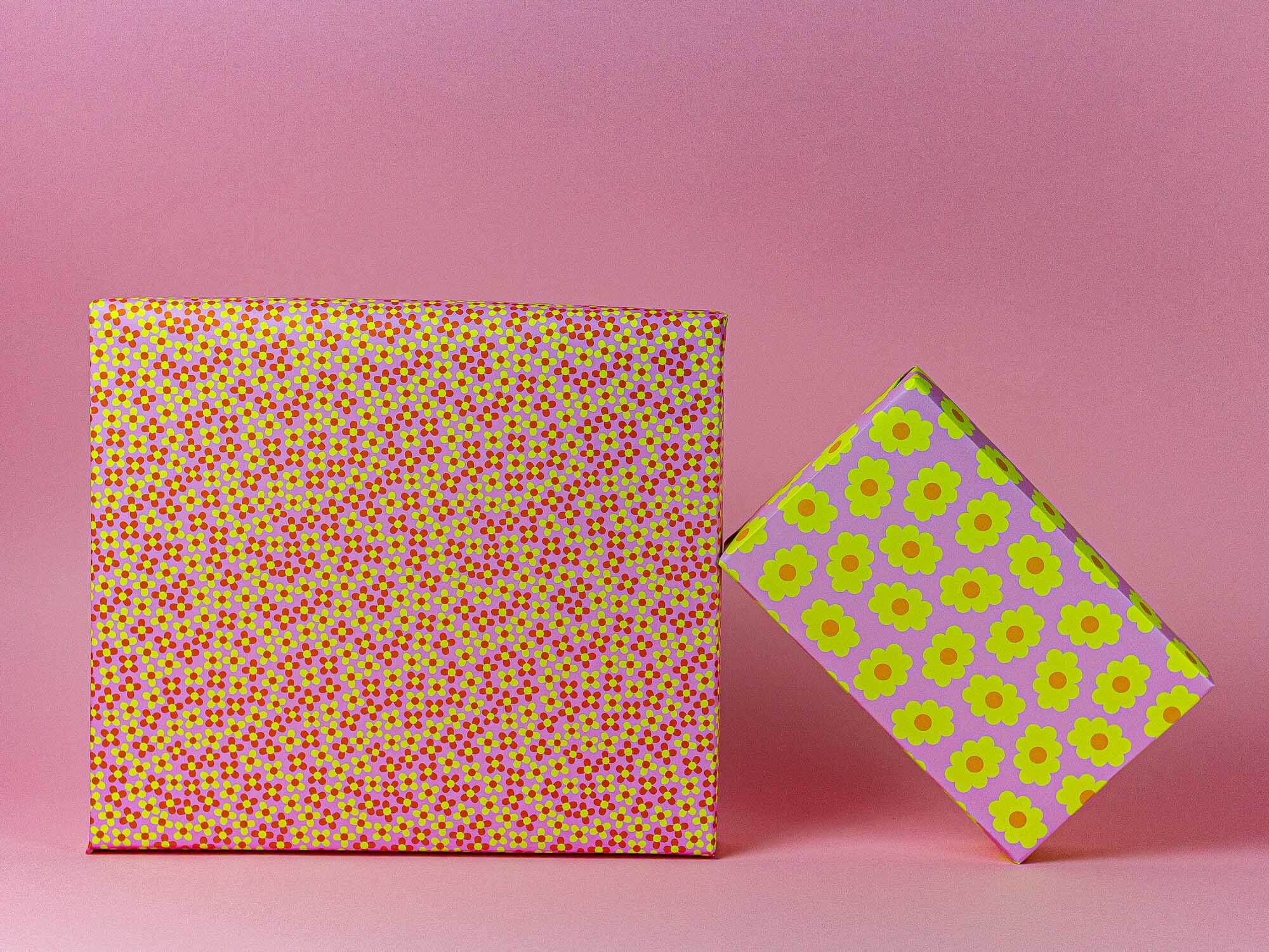 a pink and yellow box with yellow dots on it