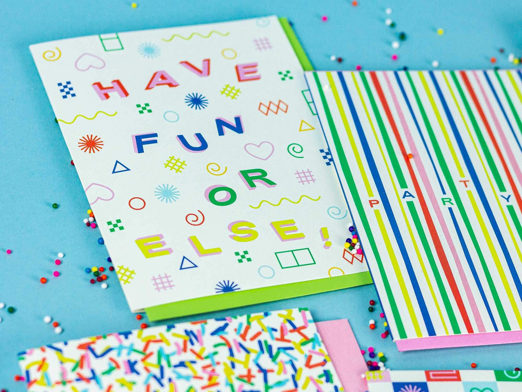 a table topped with lots of different colored papers