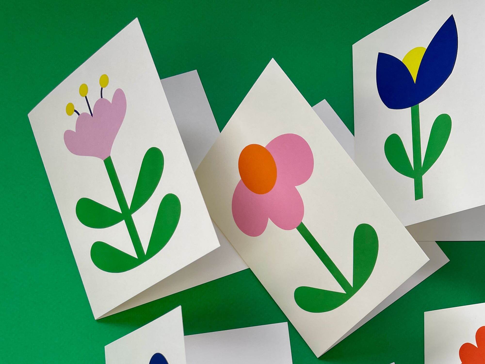 a bunch of cards that have flowers on them