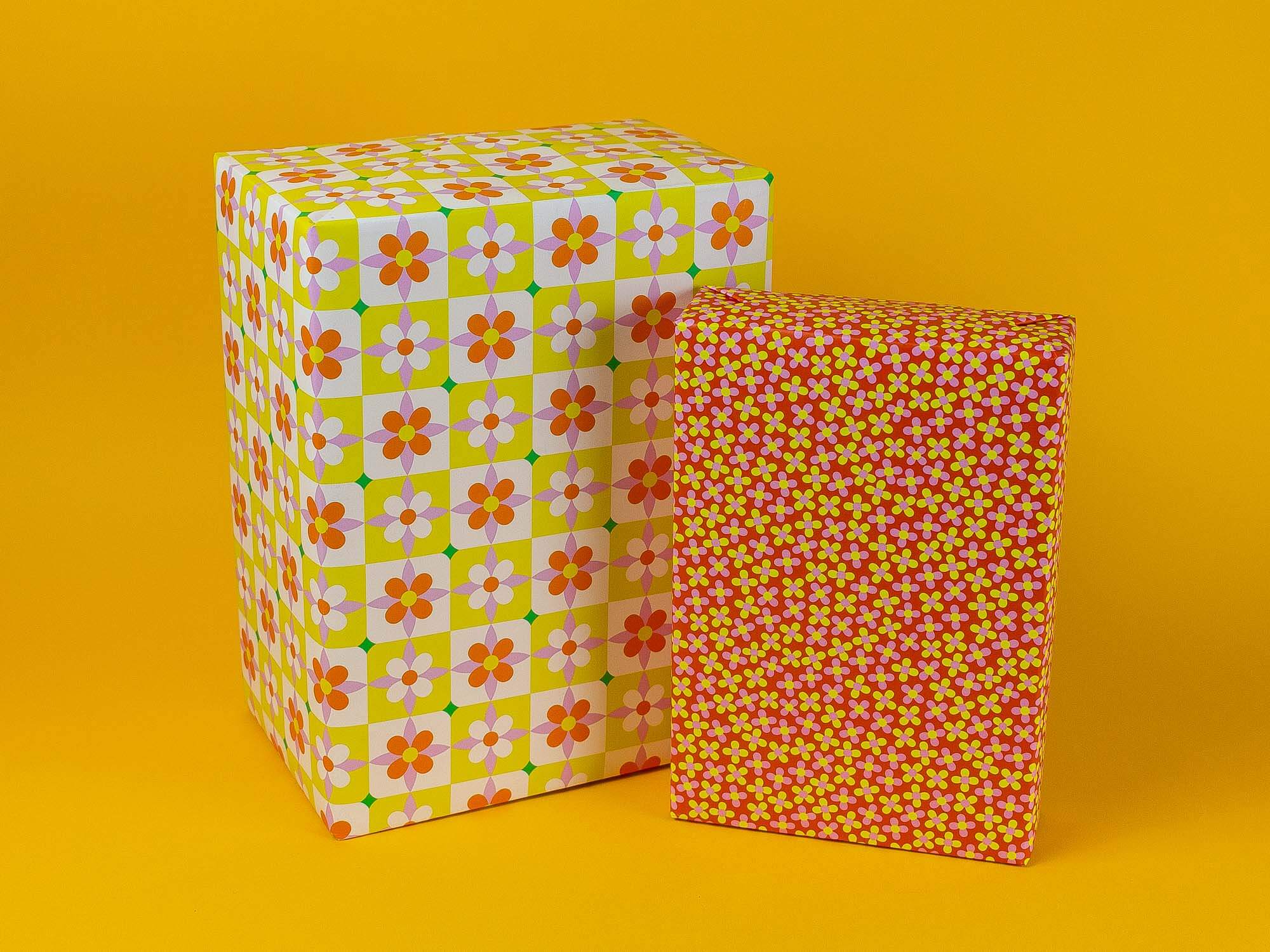a pair of boxes sitting next to each other on a yellow background