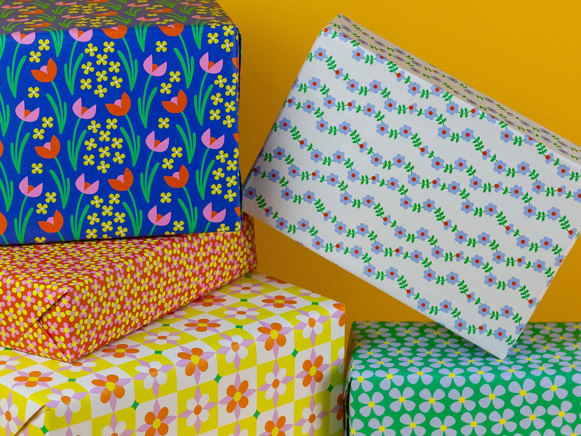a stack of wrapped presents sitting on top of each other