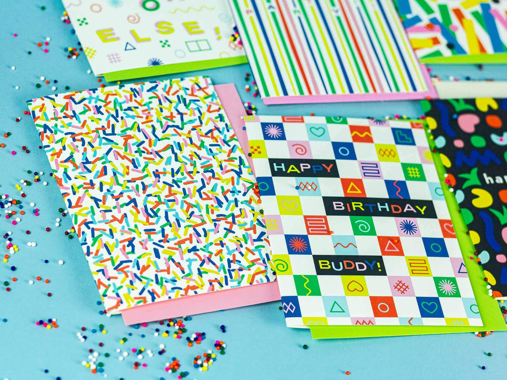 a table topped with lots of different colored papers