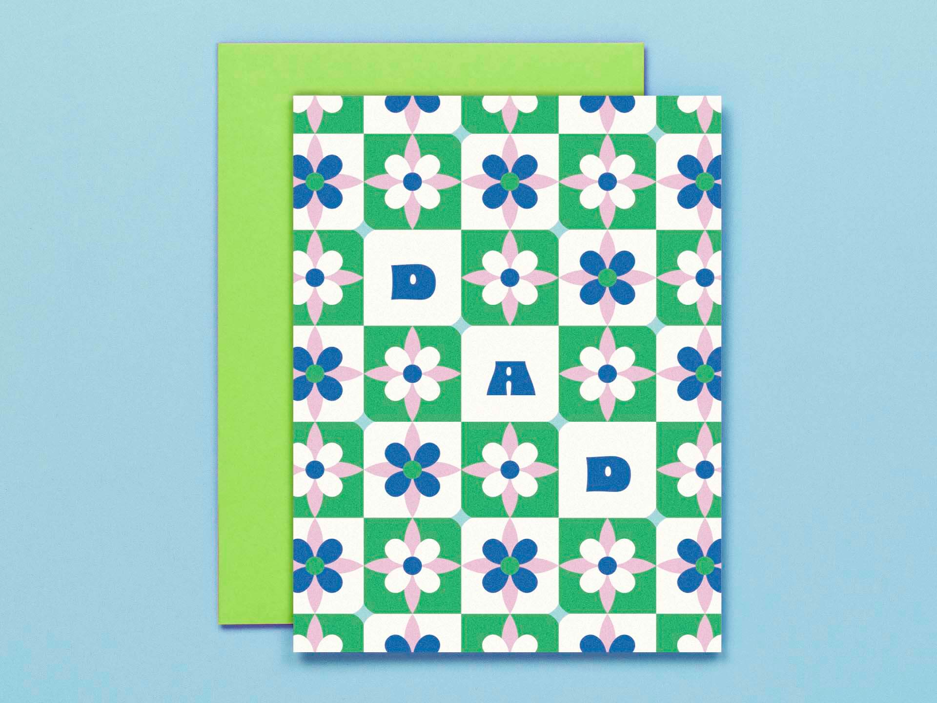 a green and white card with blue flowers on it