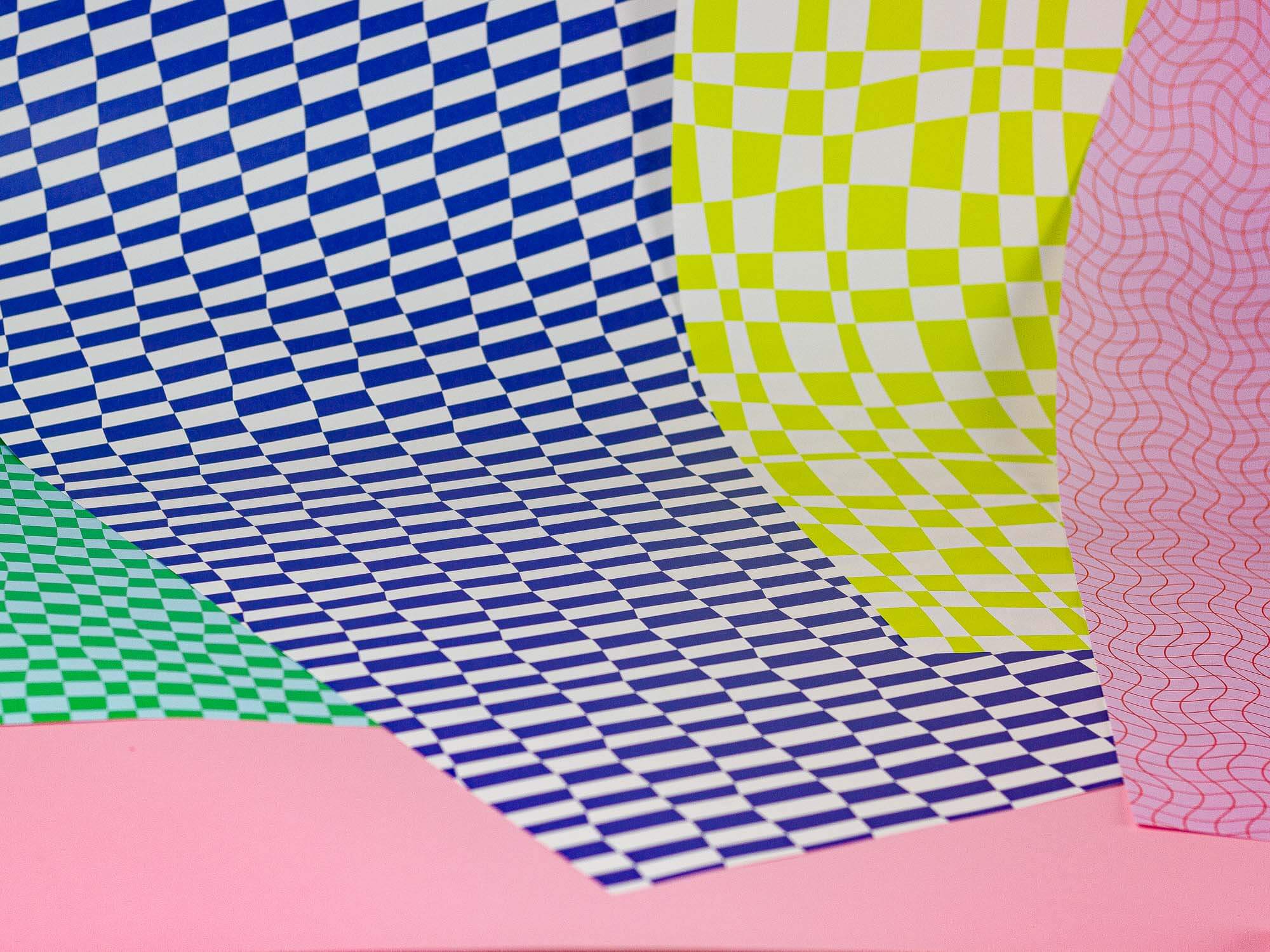 a close up of a bunch of different colored paper