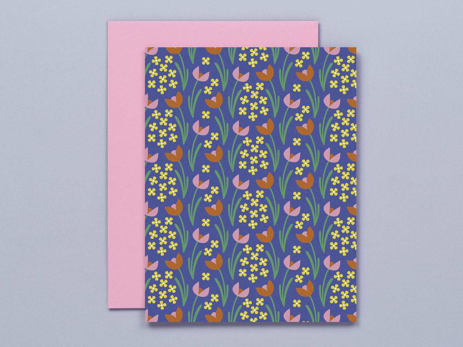 a card with a pattern of flowers on a blue background