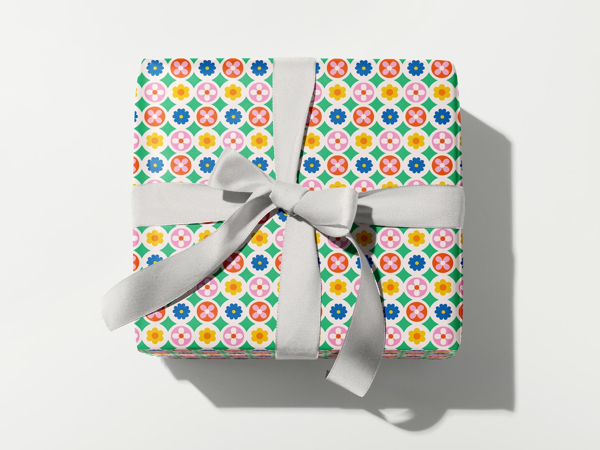 a wrapped gift with a bow on a white background