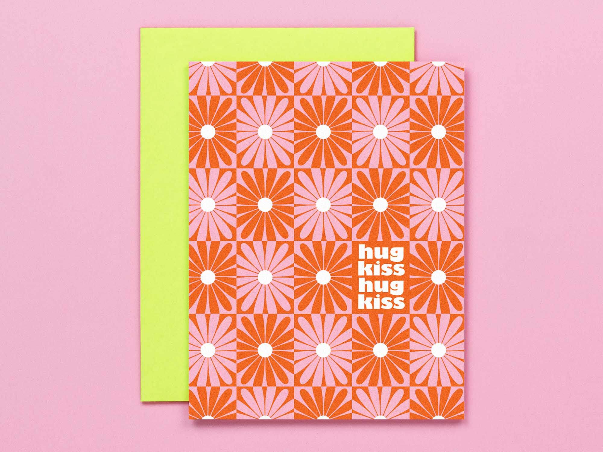 "Hug Kiss Hug Kiss" Hugs and kisses vibrating red and pink checker daisy pattern love, anniversary, or valentine's day card. Vaguely op art inspired. Made in USA by My Darlin' @mydarlin_bk