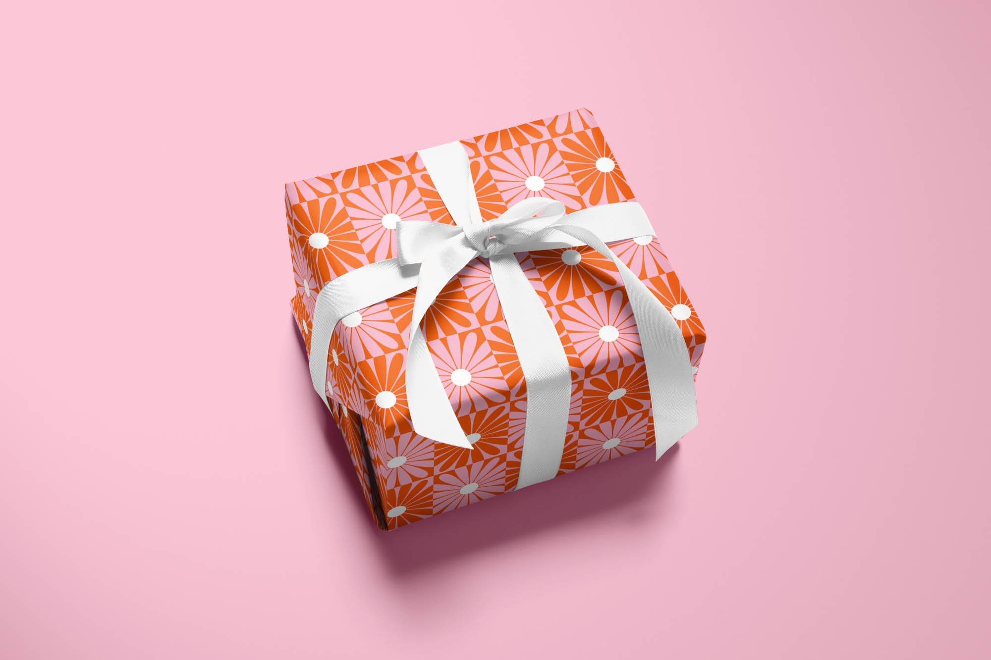 Daisy Disco red and pink mod checker daisy pattern wrapping paper. Colorful, modern, gift wrapping sheets with fun prints and patterns by @mydarlin_bk. Made in USA.