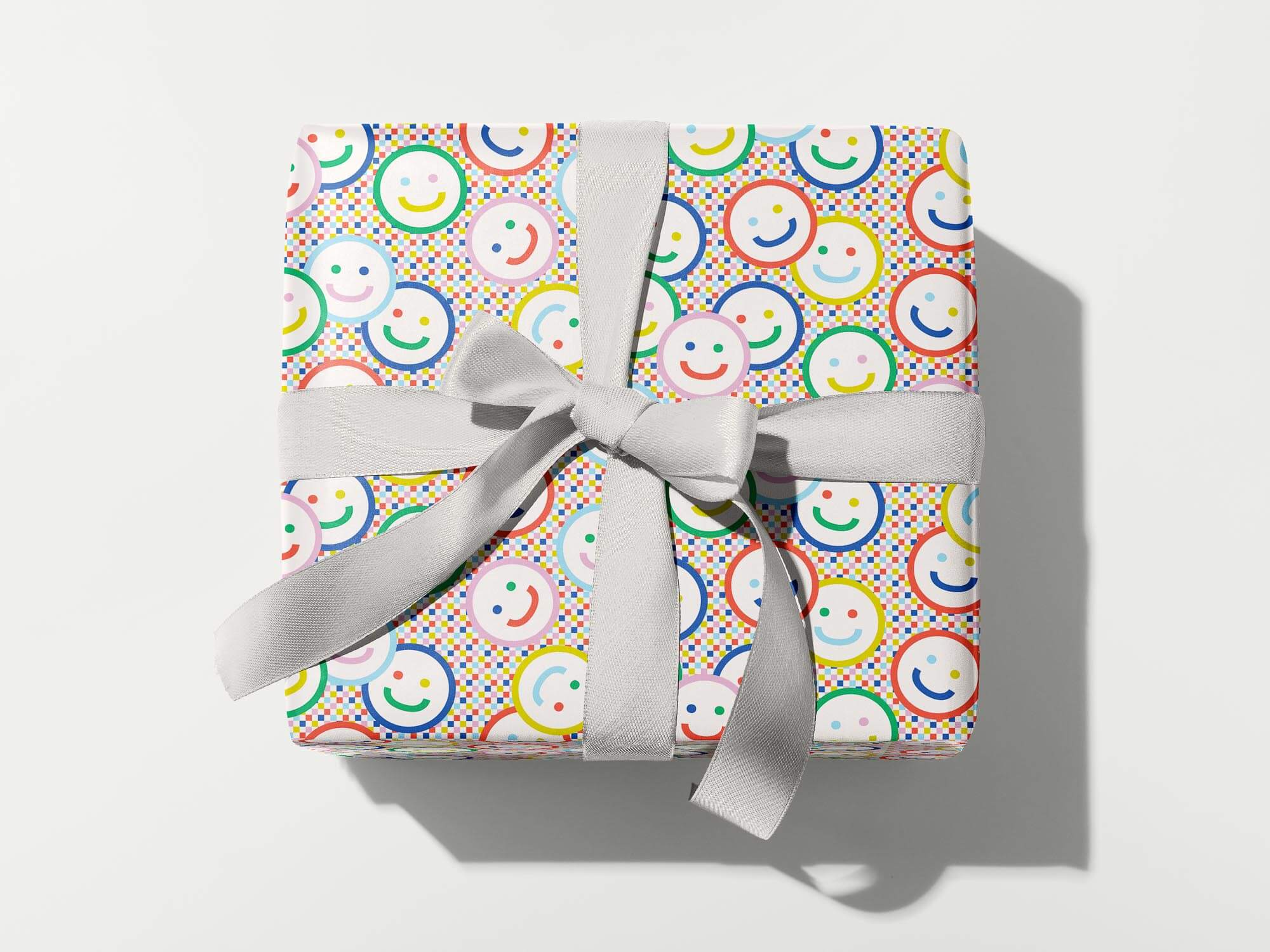 Rainbow smiley face and checker pattern wrapping paper. Colorful, modern, gift wrapping sheets with fun prints and patterns by @mydarlin_bk. Made in USA.