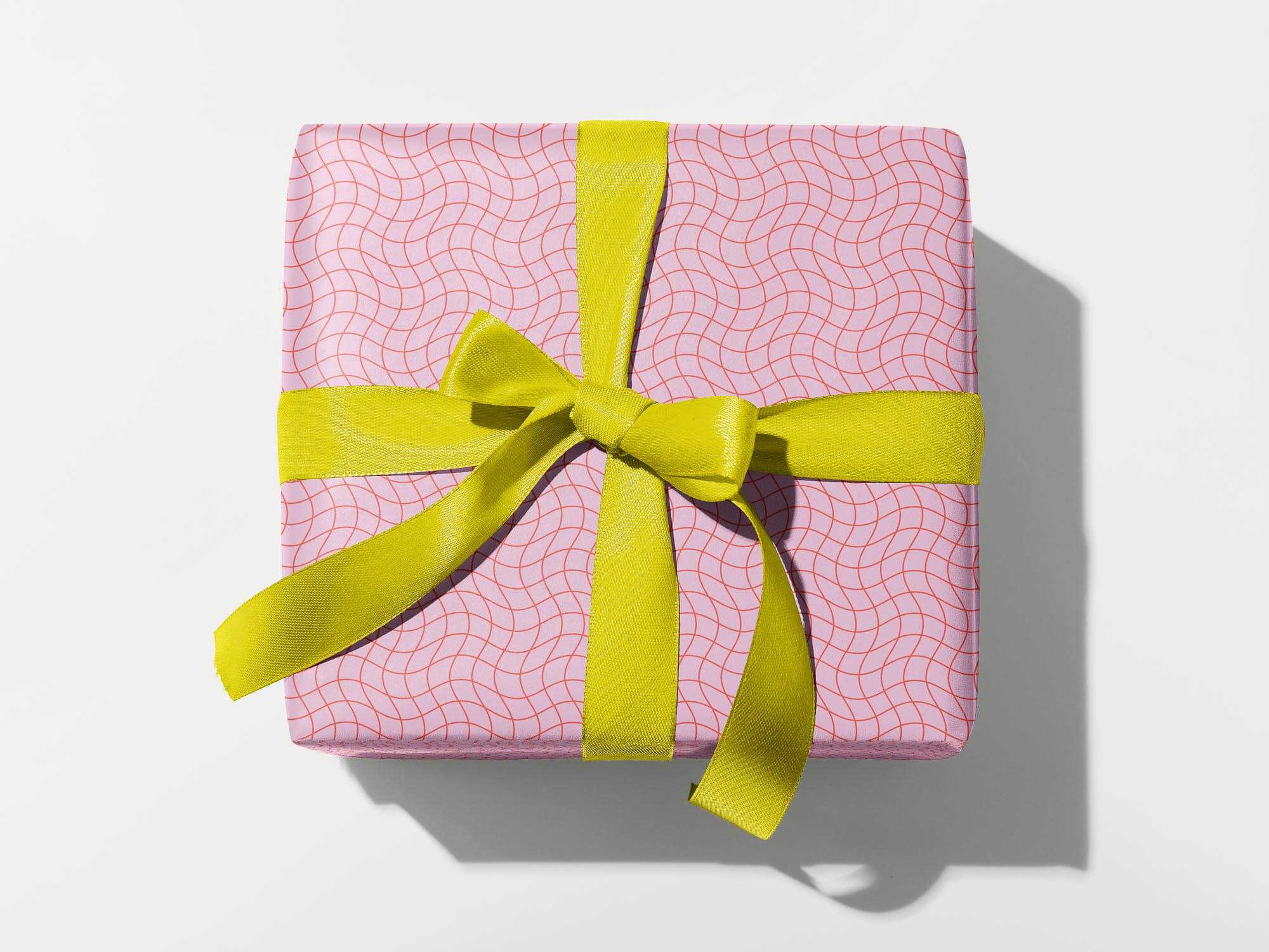 La Grid En Rose red and pink wavy grid pattern wrapping paper. Colorful, modern, gift wrapping sheets with fun prints and patterns by @mydarlin_bk. Made in USA.