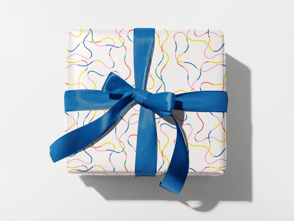 Magic Pencil is a fun abstract rainbow squiggle pattern on these colorful, modern, gift wrapping sheets by @mydarlin_bk. Made in USA.