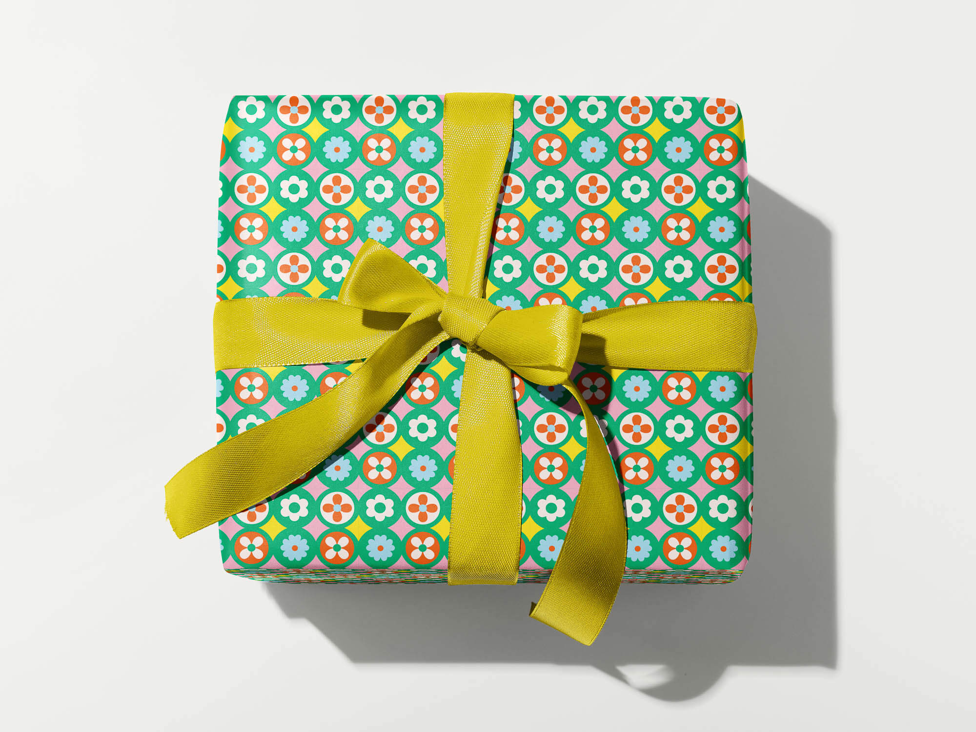 Mid-century Christmas wrapping paper with a jazzy razzle dazzle retro flower pattern. Made in USA by @mydarlin_bk