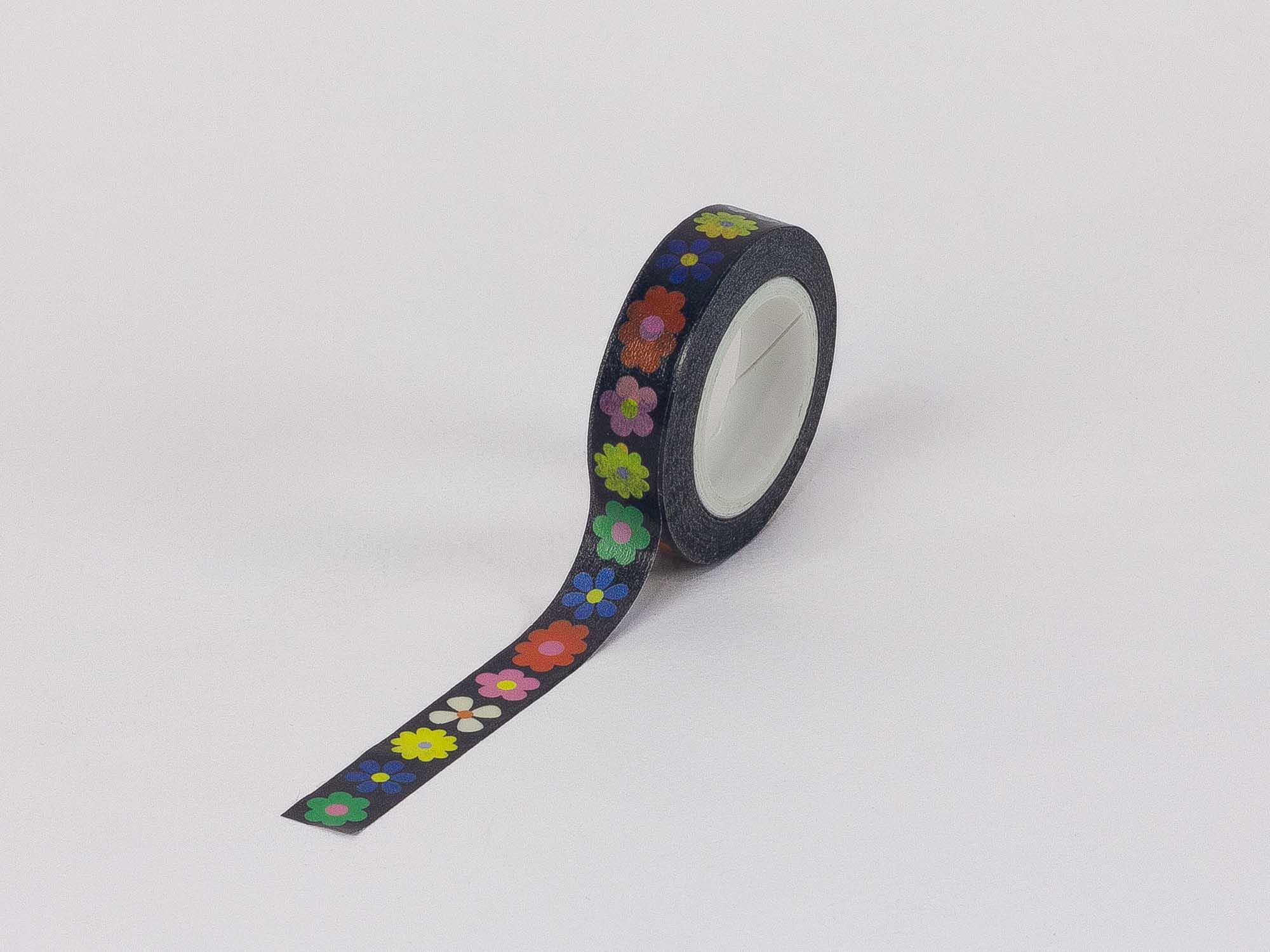 multicolored flowers against a black background on skinny washi tape 
