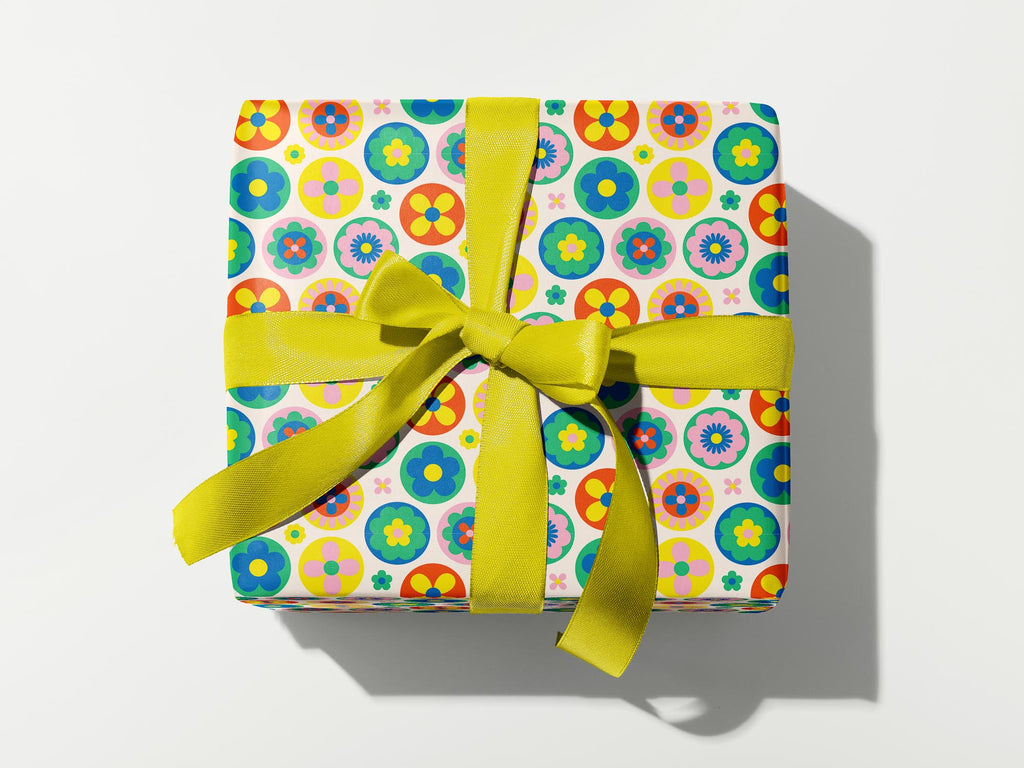 a wrapped gift with a yellow ribbon