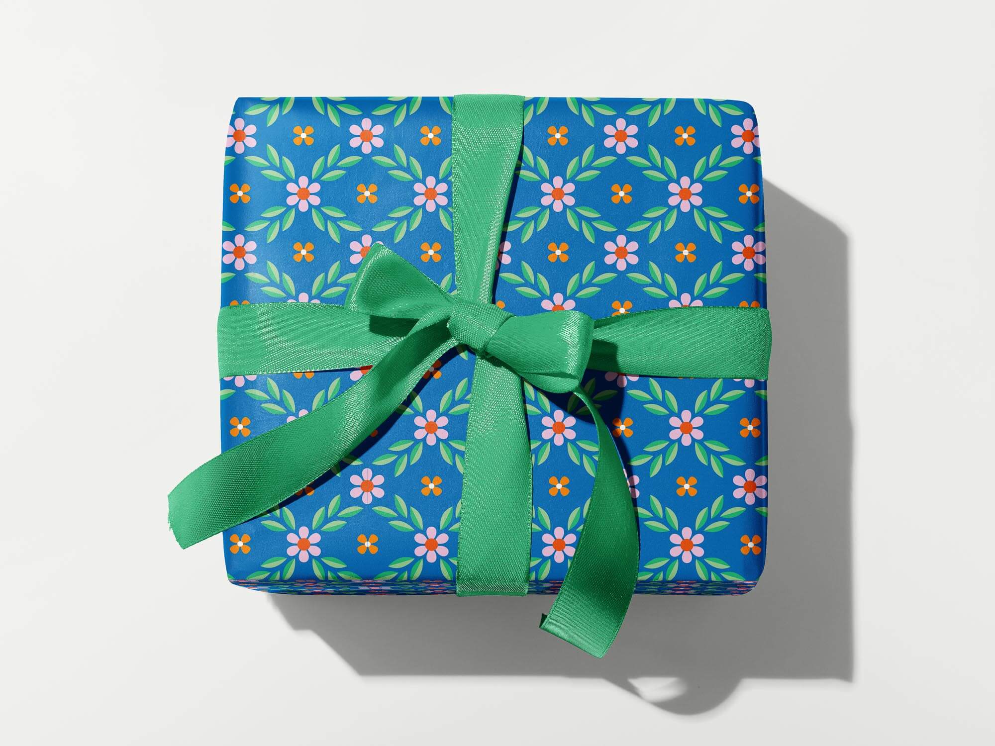 a blue gift box with a green bow