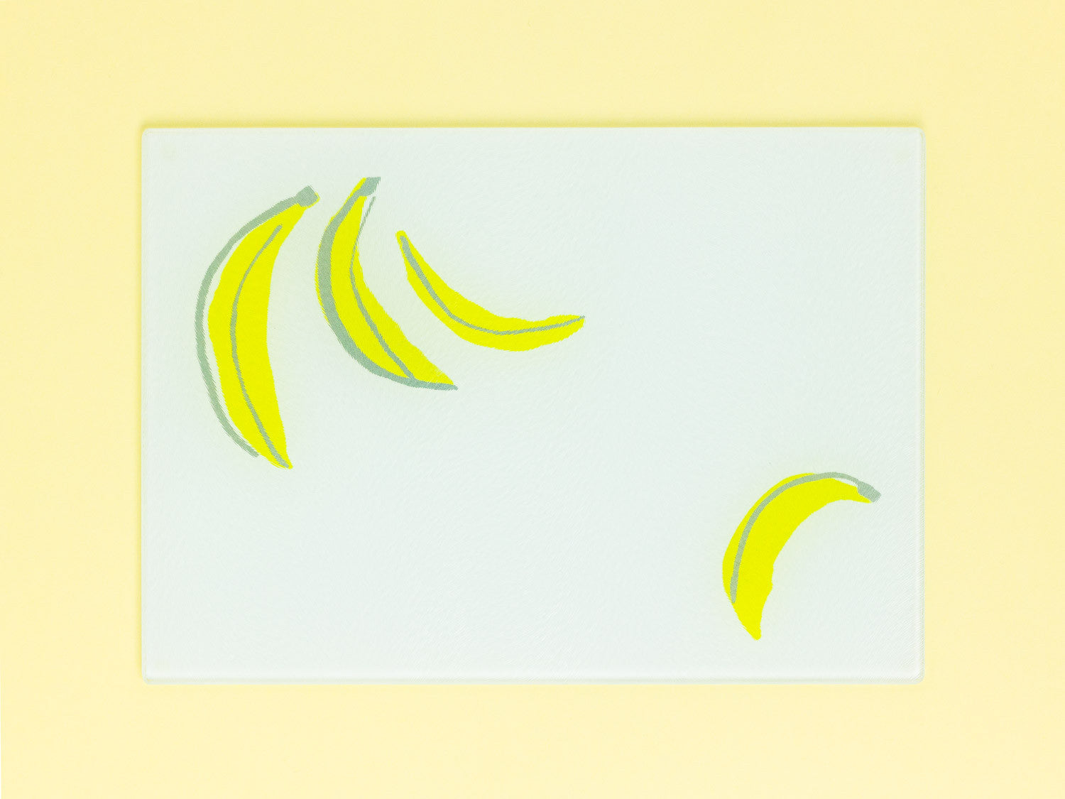 Floating Bananas Tempered Glass Cutting Board