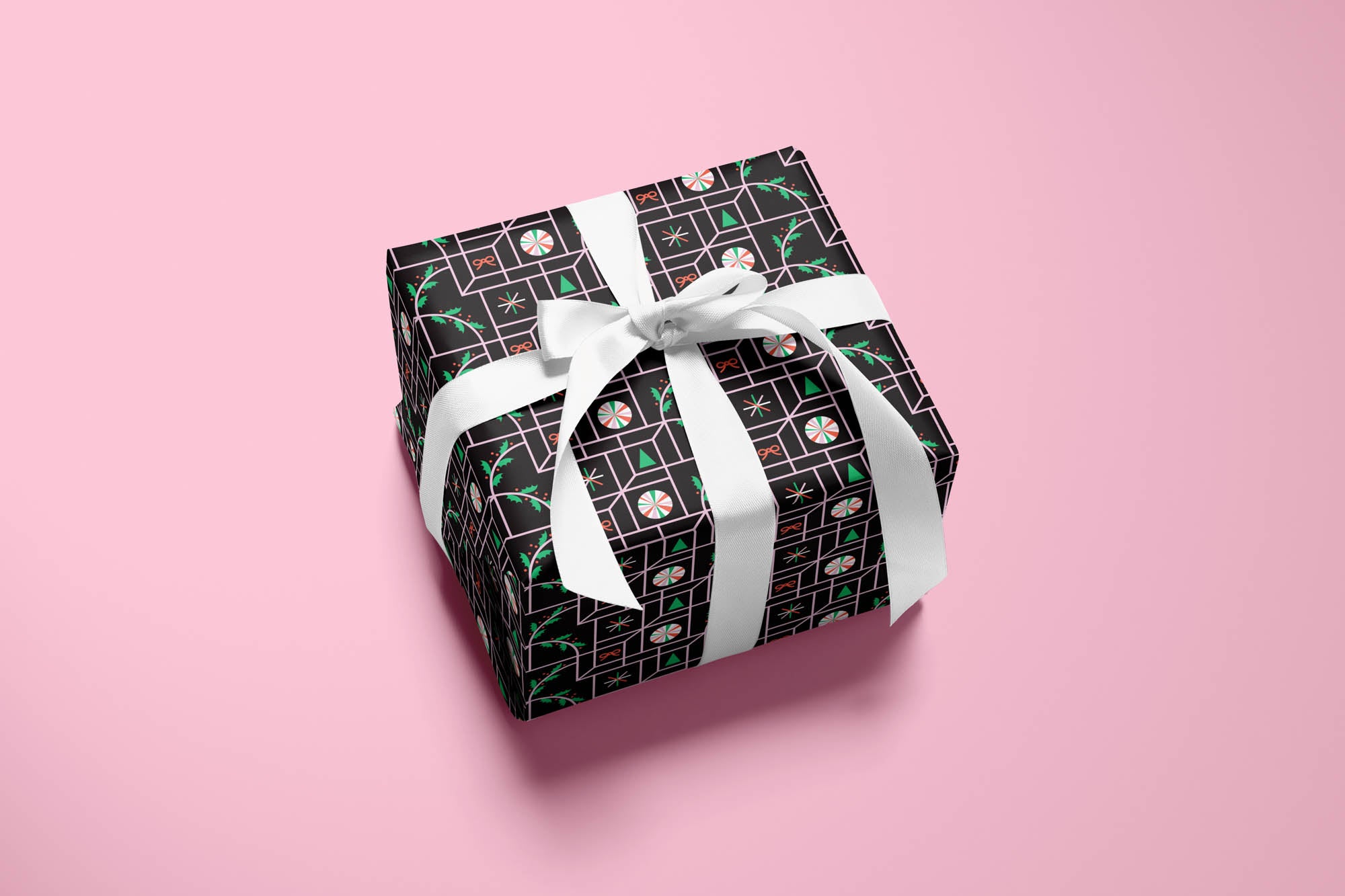 Mid-century and op art inspired optical illusion wrapping paper with pattern of peppermints, holly, bows, Christmas trees, and twinkly stars. Colorful, modern, holiday gift wrap with fun prints and patterns by @mydarlin_bk. Made in USA.
